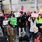 Protesters at JFK Airport<br>(<a href="https://www.instagram.com/juliusmotalphoto/">Julius Motal</a> / Gothamist)